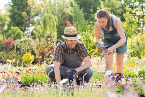 Gardener working in a terraced Tooting garden